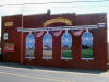 Jeremy Sams mural on a building in downtown Claremont NC
